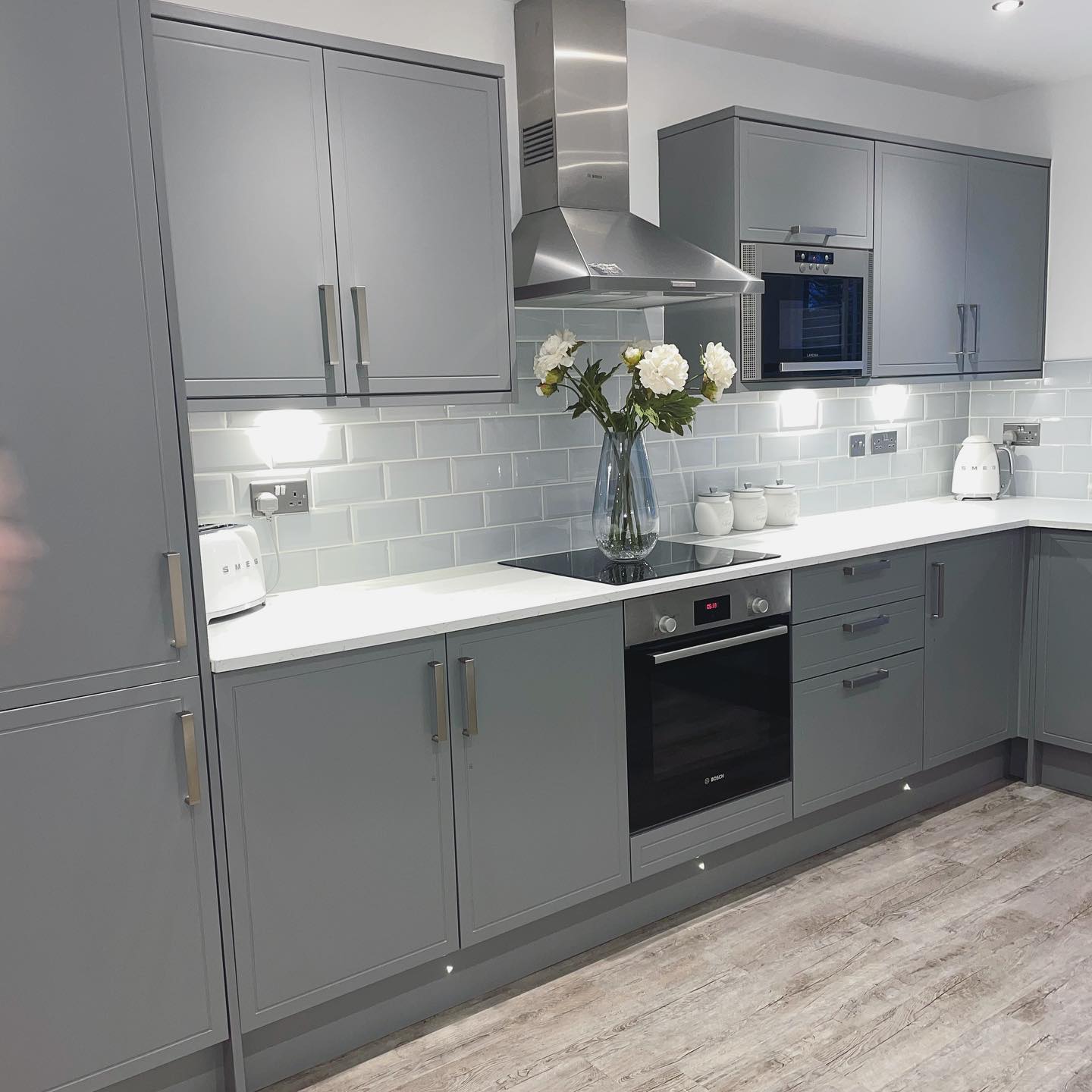Howdens Kitchen, Otley. Grey with white worktop and built in appliances
