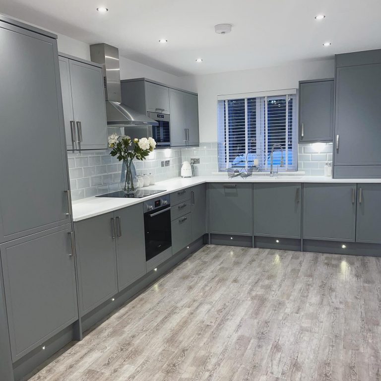Howdens Kitchen, Otley. Grey with white worktop and built in appliances