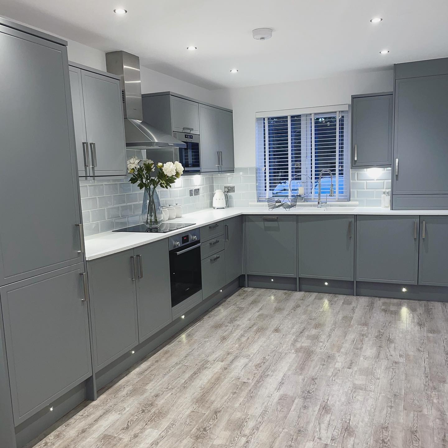 Howdens Kitchen, Otley. Grey with white worktop and built in appliances