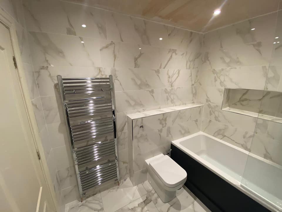 Marble tile bathroom, Menston with LED mirror