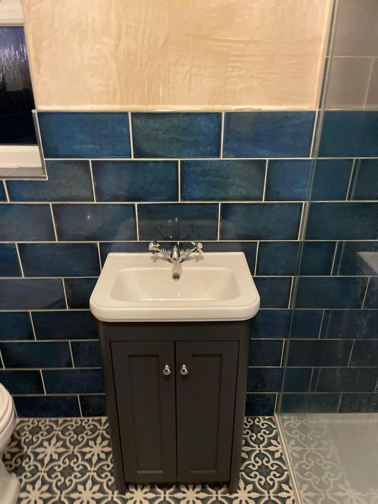 Modern blue bathroom design Guiseley with patterned tiles