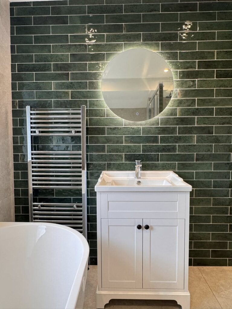Green tiled bathroom with floor standing bath, Otley