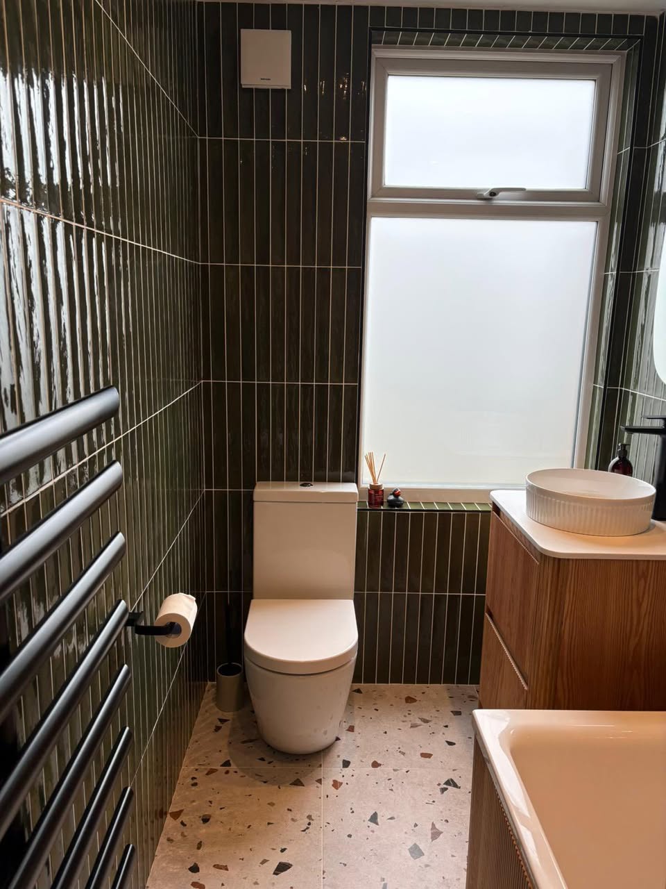 Modern pink and green tiled bathroom with tiled floor Otley West Yorkshire