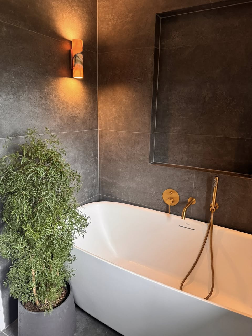 Bathroom sanctuary SR Kitchen and Bathrooms Otley with grey bathroom tiles for the spa type bathroom