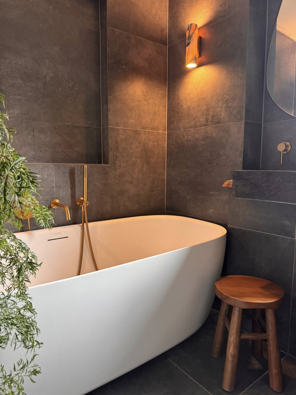 Bathroom sanctuary SR Kitchen and Bathrooms Otley with grey bathroom tiles for the spa type bathroom