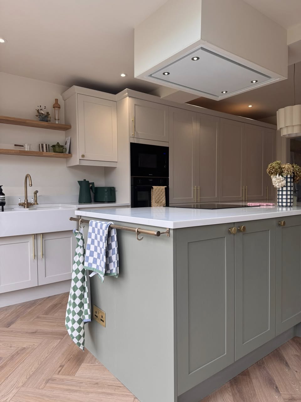 SR Kitchen renovation and installation of Kitchen Otley with cream kitchen units and granite worktop, gold kitchen handles and tap with kitchen island and underfloor heating. A stunning kitchen transformation in Otley