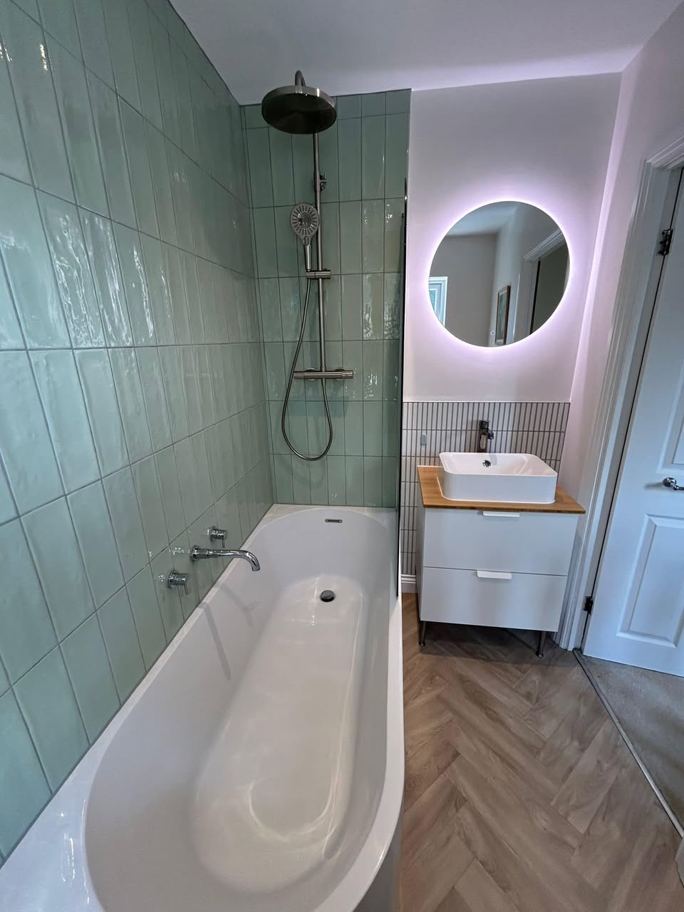 sage green bathroom with floating sink unit