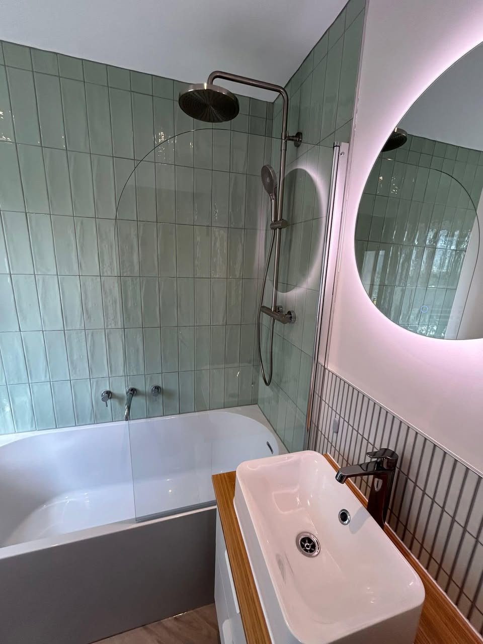 sage green bathroom with floating sink unit
