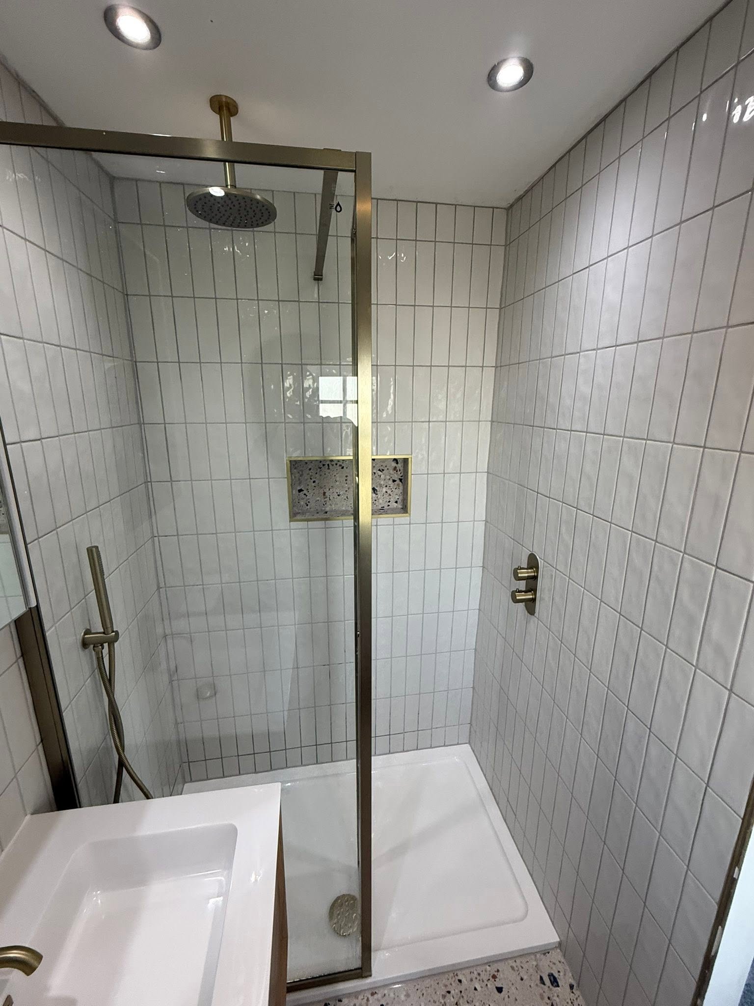 white modern bathroom shower room with gold fixtures Otley